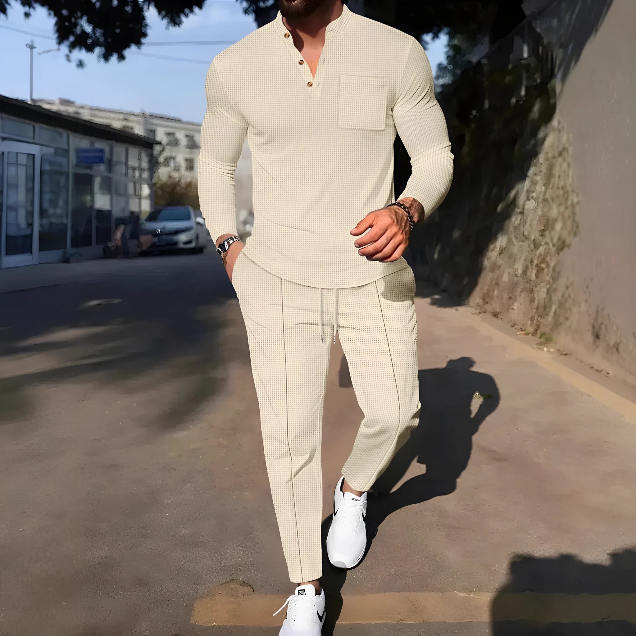 Men's waffle henley long sleeve t-shirt and matching long pants casual set in gray on a model