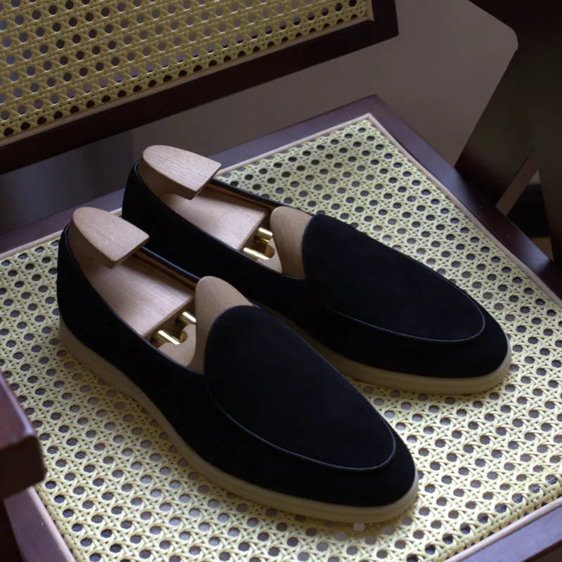 British handmade brown leather loafers for men on a white background