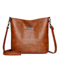 Women's soft leather large capacity shoulder bag in bucket shape with minimalist luxury styling