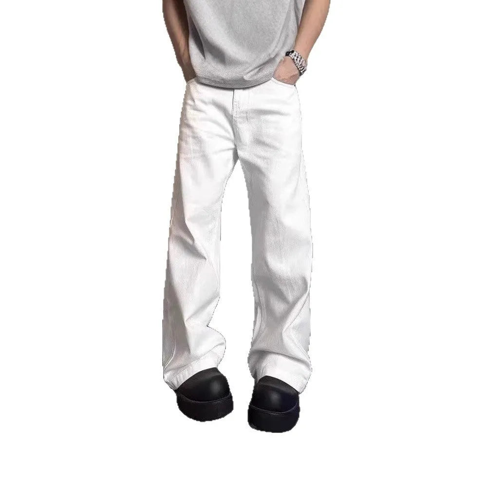 A pair of men's straight-leg white jeans with a mid-rise waist and zipper fly on a plain background.