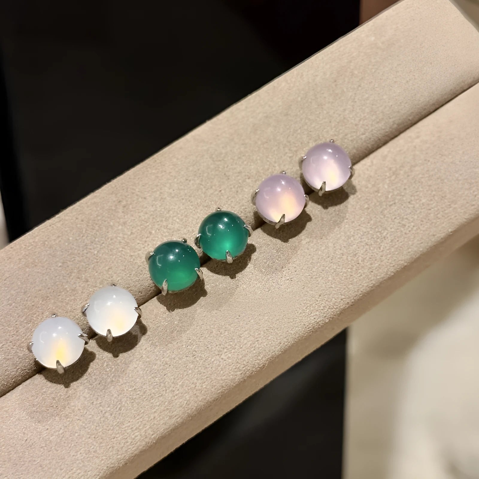 Chalcedony stud earrings with round egg stone in copper four-claw setting, emerald green colour