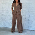 Brown men's slim fit polyester suit with jacket and trousers on hanger