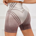 Brown and black gradient high waisted fitness shorts for women on a mannequin.