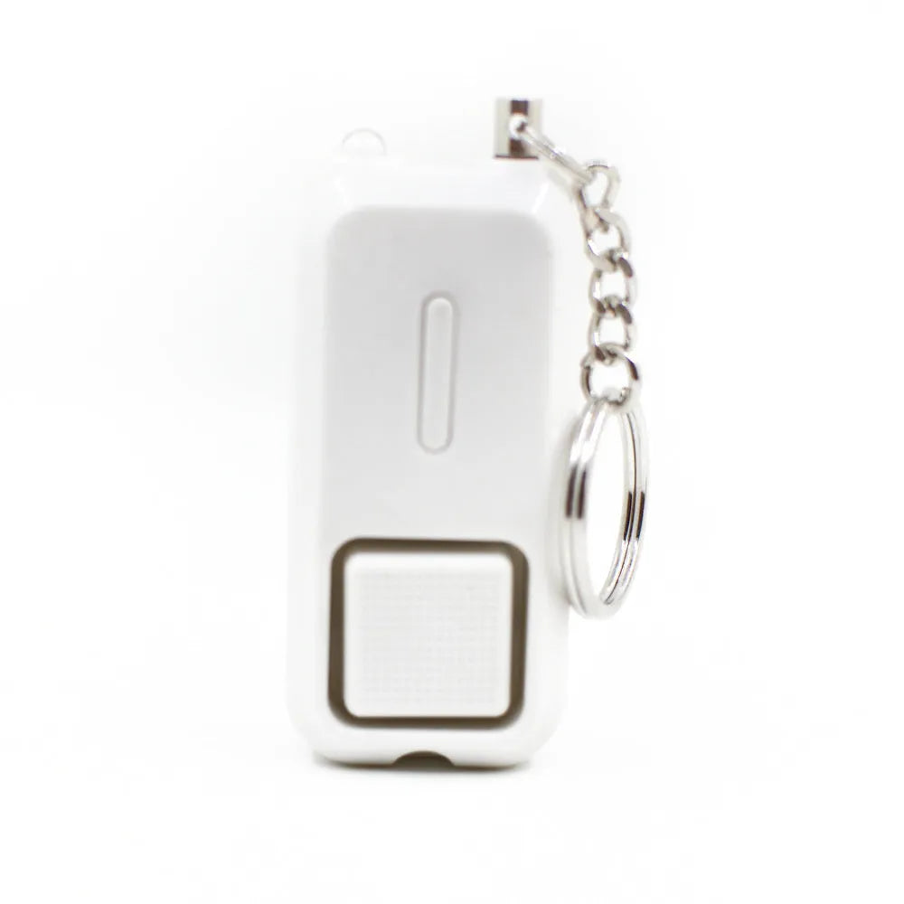 Pink personal security alarm showing compact size next to LR44 batteries