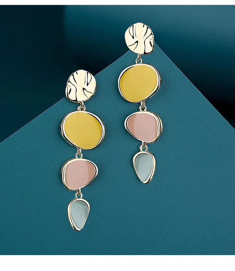 Morandi three-colour oil drip finish on a pair of simple alloy disc earrings with sterling silver posts.