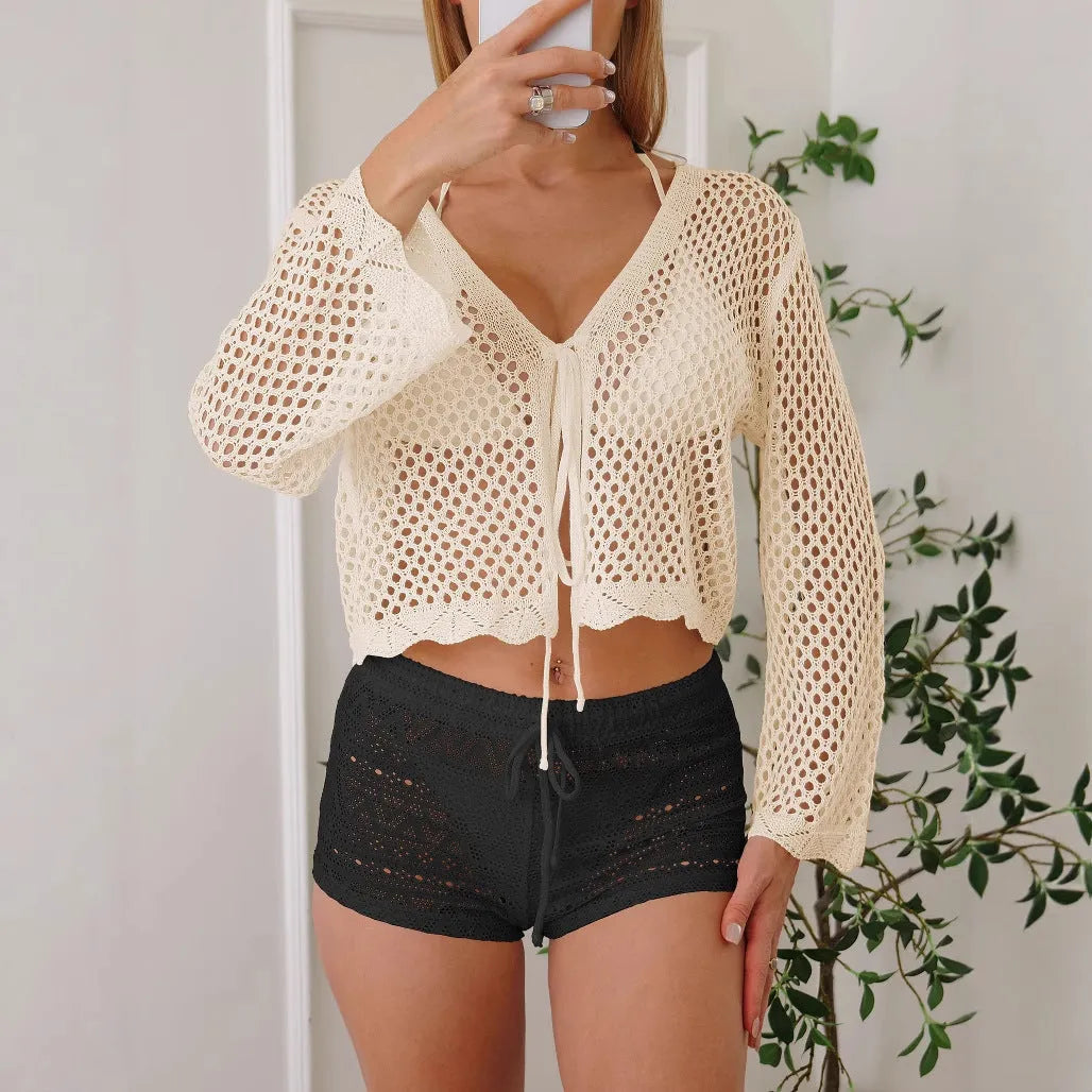 Short apricot women's cardigan blouse with bell sleeves made from hollow woven imitation cotton fabric.