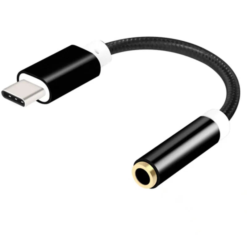Close-up of a short black nylon Type-C to 3.5mm female headphone adapter cable.