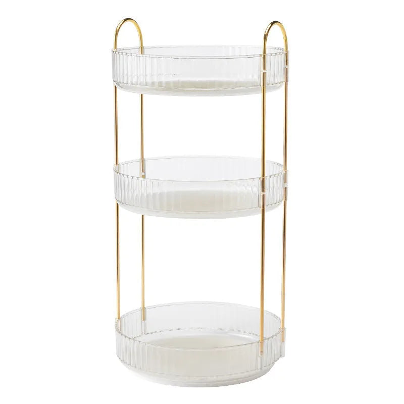 Three-layer rotating bathroom cosmetics storage rack in green, yellow, and white on a desktop
