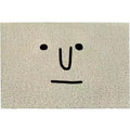 Square PVC floor mat with a geometric cartoon face pattern in Mr Big Nose colours.
