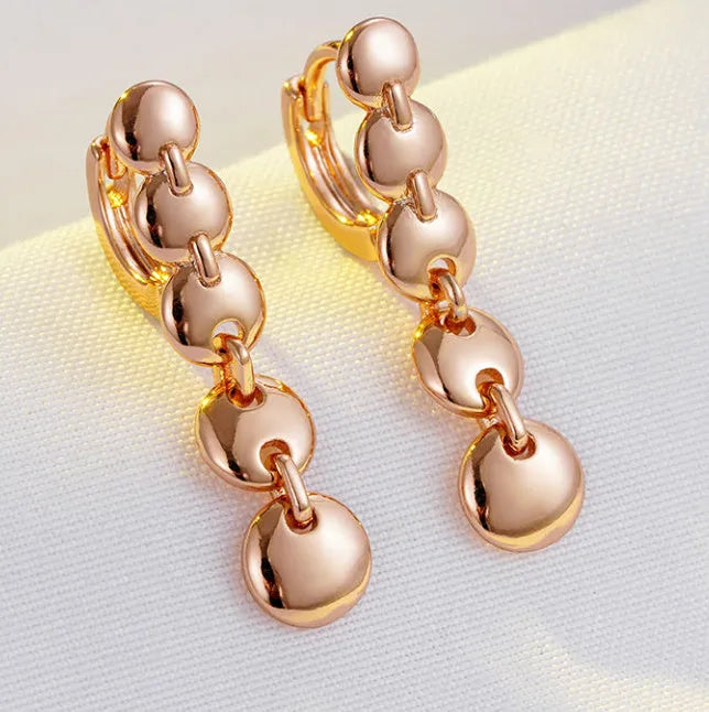 Retro long copper circle earrings with woven wirework and gold-coloured finish