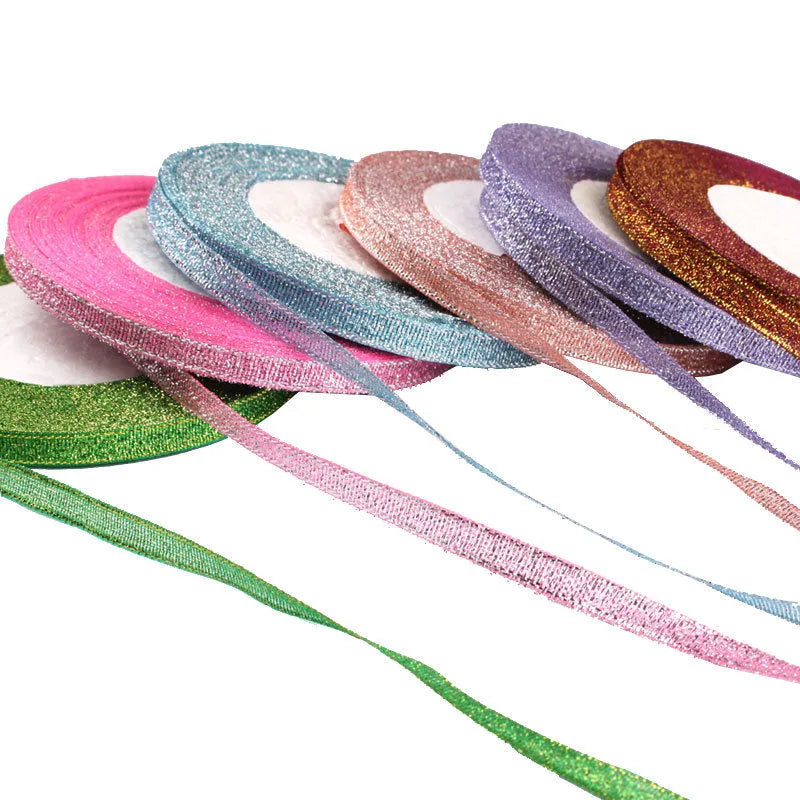 Roll of narrow 0.6cm wide polyester decorative ribbon in multiple colour options including metallic finishes