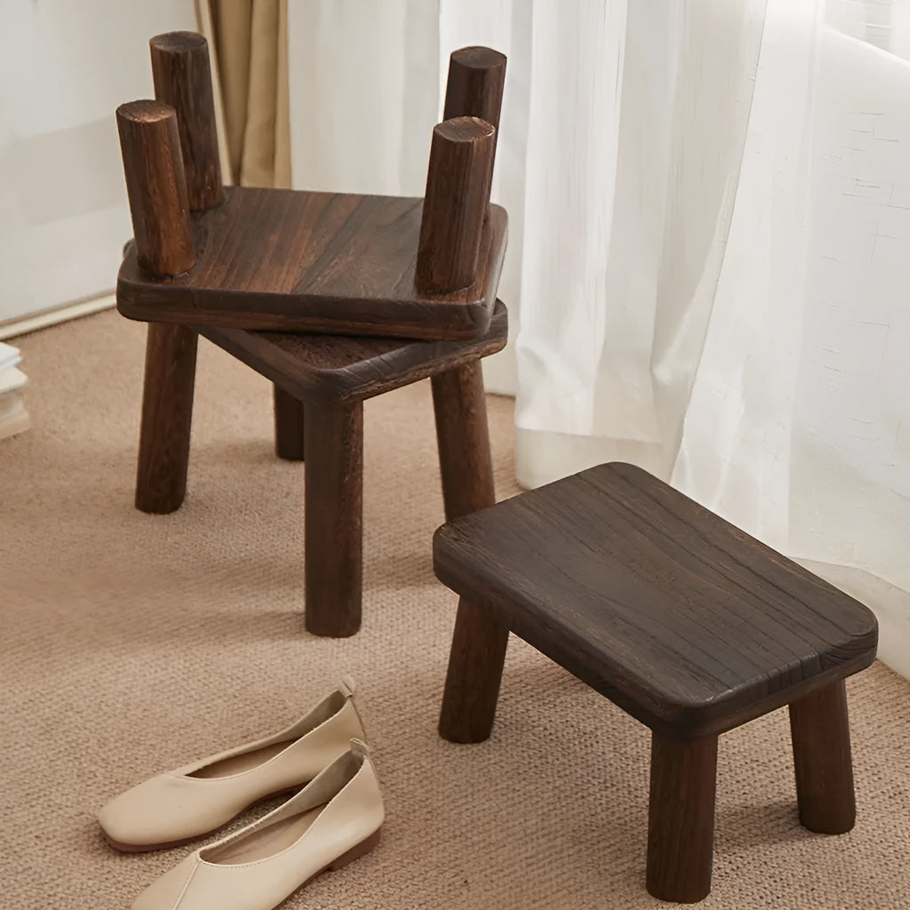Distressed solid wood changing stool with bracket structure for hallway or living room.