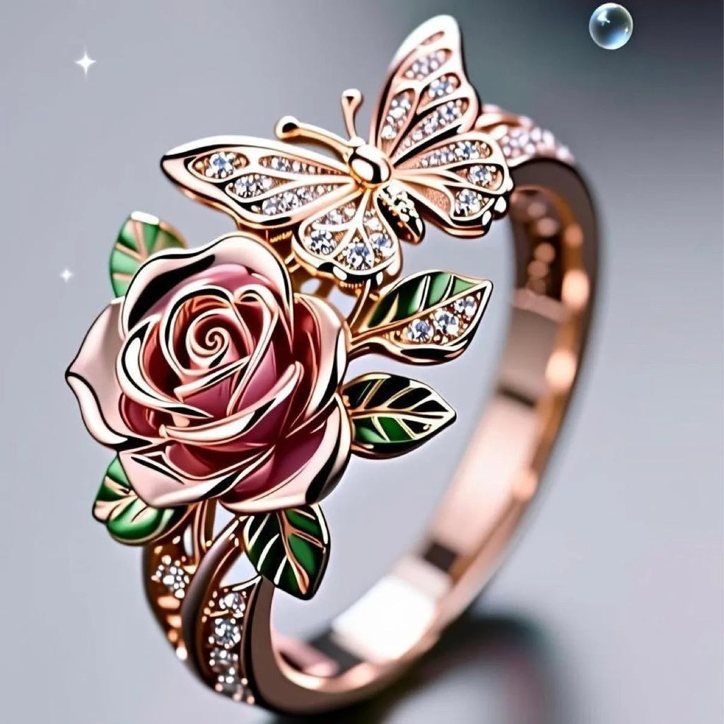 Close-up of an adjustable fairy style ring with a colourful oil-drip butterfly, rose, and leaf design in alloy.