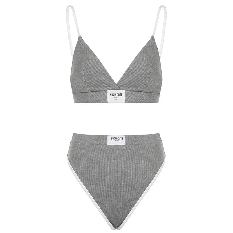 Women's embroidered bikini set with contrast colour binding in polyester fabric showing sleeveless top and shorts-length bottoms