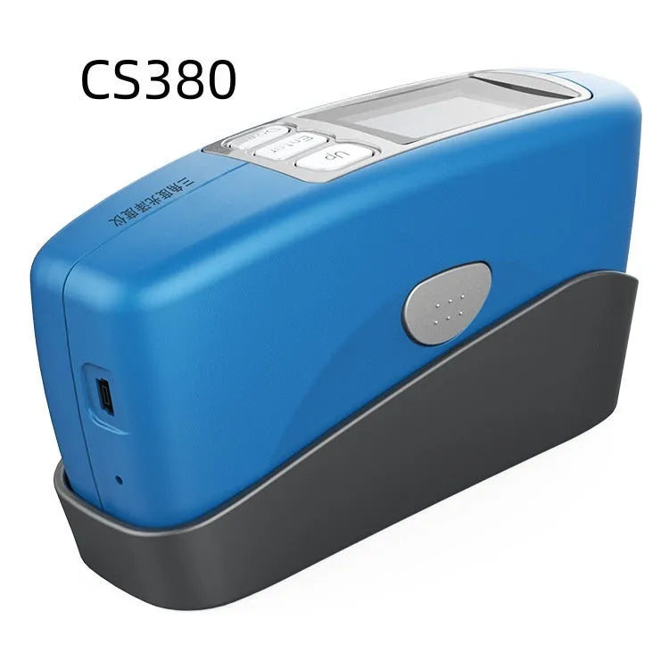 Handheld ceramic brightness stone portable glossiness tester gloss meter on a work surface.