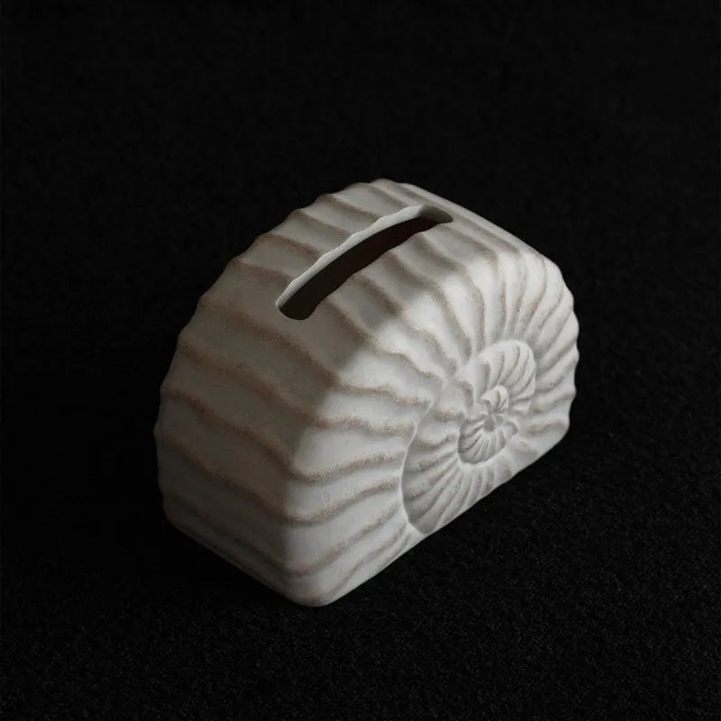 Conch coloured resin tissue box with modern minimalist design for home decor
