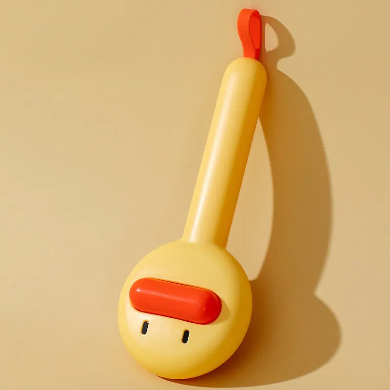 Small yellow duck-shaped pet grooming comb with needle teeth for cat and dog hair removal