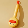 Small yellow duck-shaped pet grooming comb with needle teeth for cat and dog hair removal