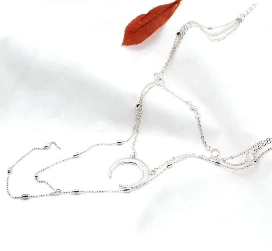 Gold silver multilayer crescent moon bead chain initial choker necklace on display with adjustable 35 cm chain and alloy finish