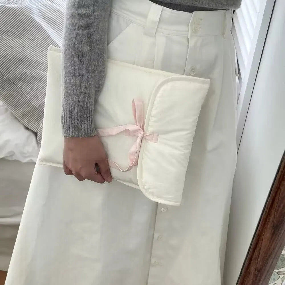 Women's black and white striped ballet bow quilted computer bag showing nylon material