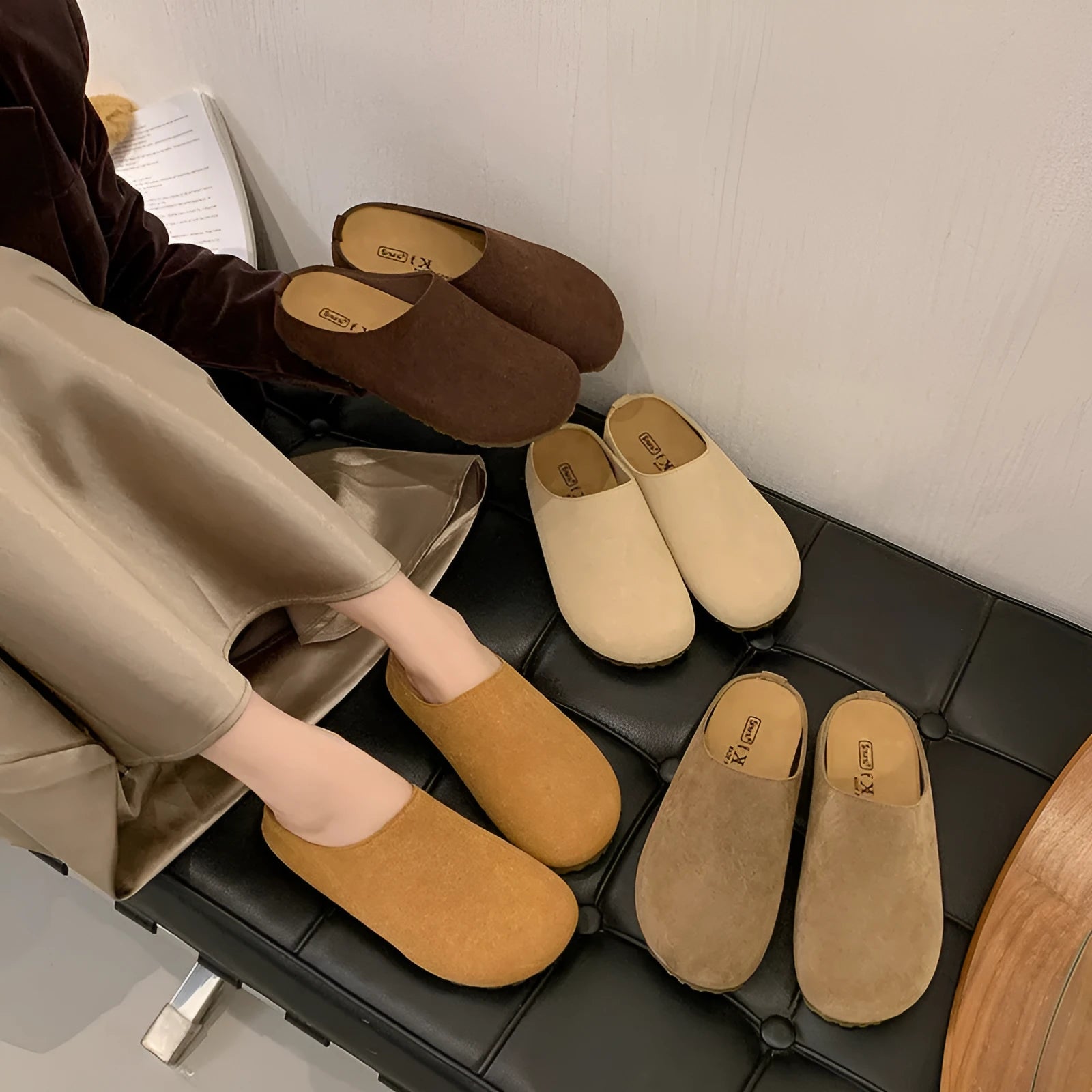 Flat outdoor slip-on slippers with square toe in apricot colour on a plain background.