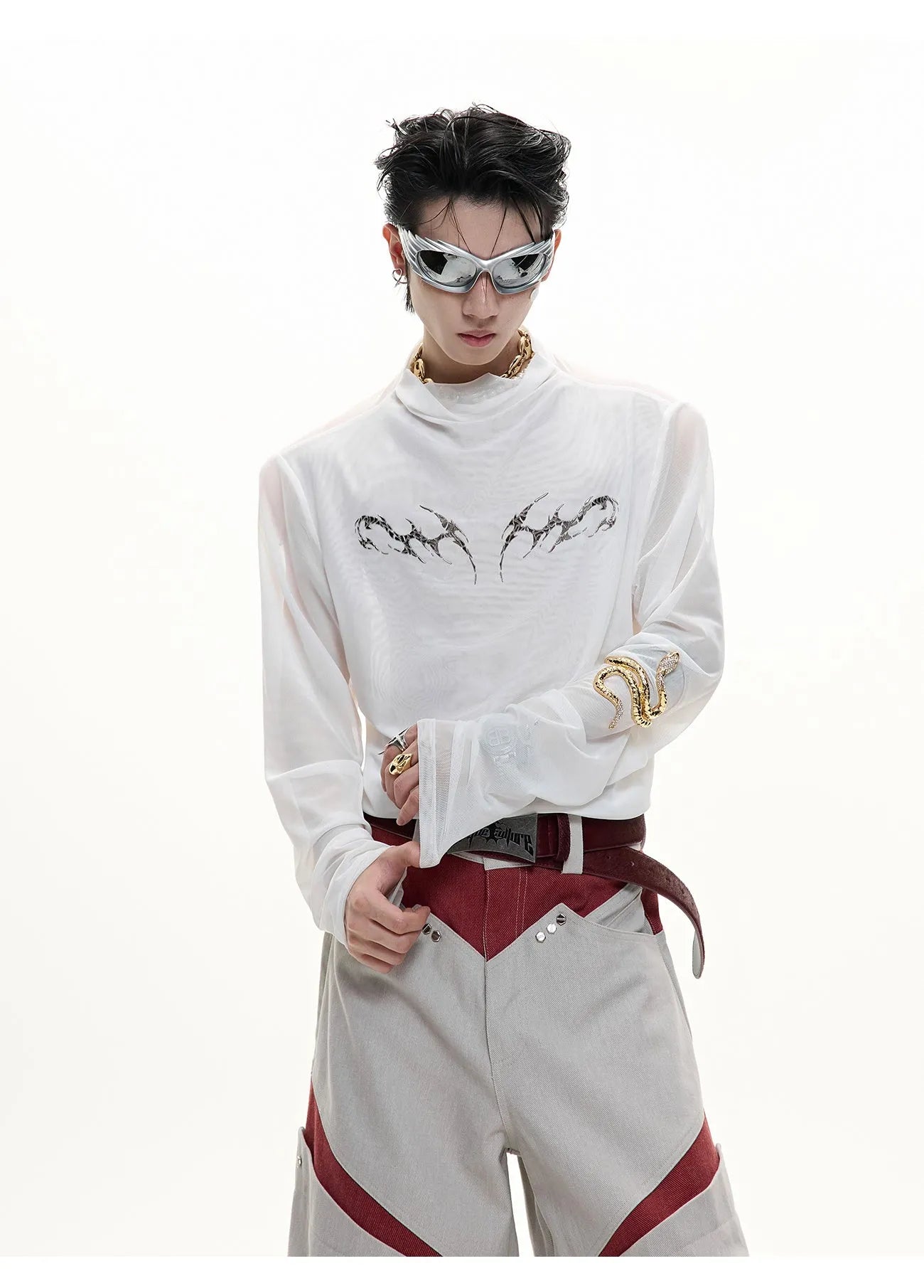Black mesh slim-fit long sleeve base layer shirt laid flat, showing its texture and cut.