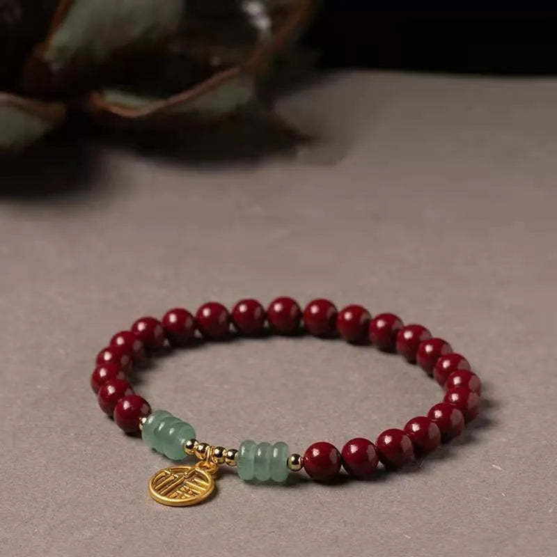 Handcrafted Chinese cinnabar bracelet with gold copper beads in wave design on wrist