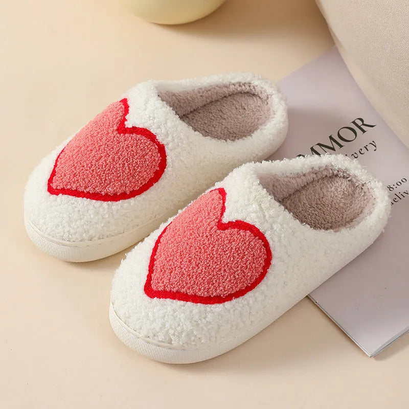 Plush cartoon love style slippers for women with non-slip PVC soles in multiple colours.
