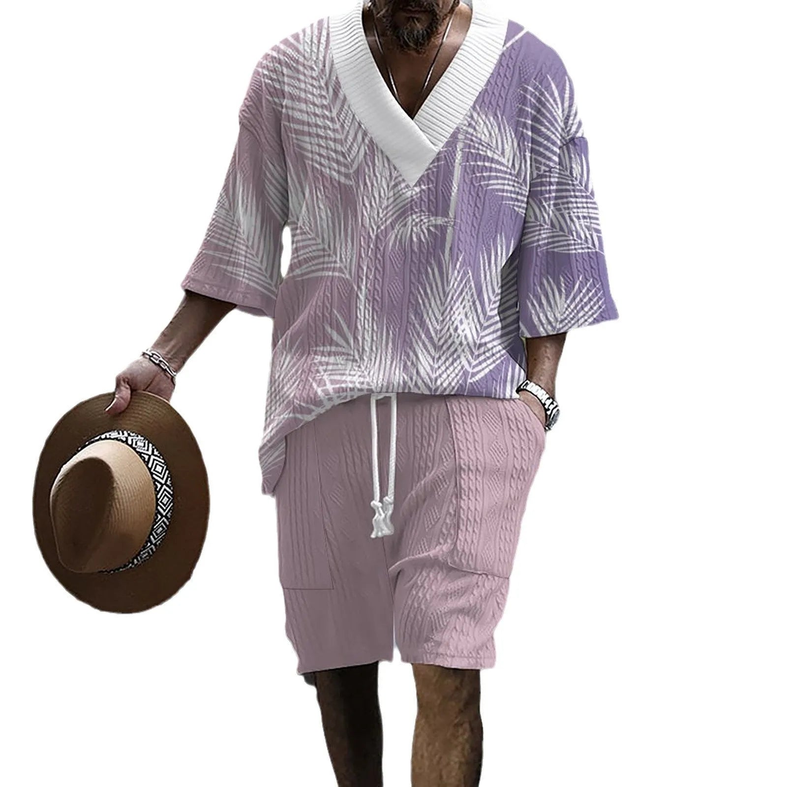 Man wearing a grey printed knitted short-sleeved top with drop shoulders and matching shorts, a casual two-piece suit set.