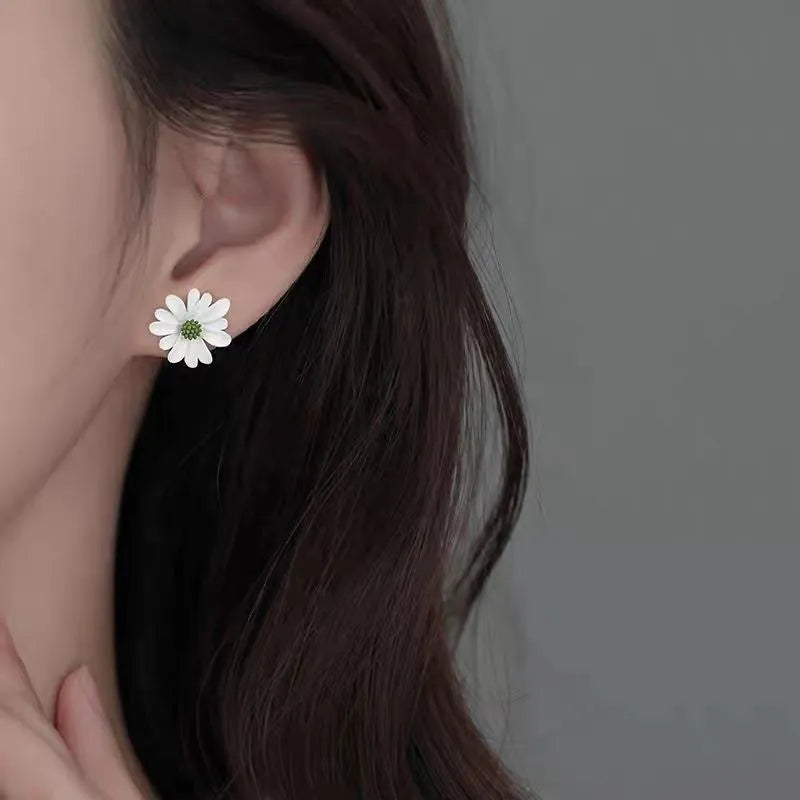Alloy flower-shaped stud earrings in two-tone blue orange, white green, and yellow white colour combinations.