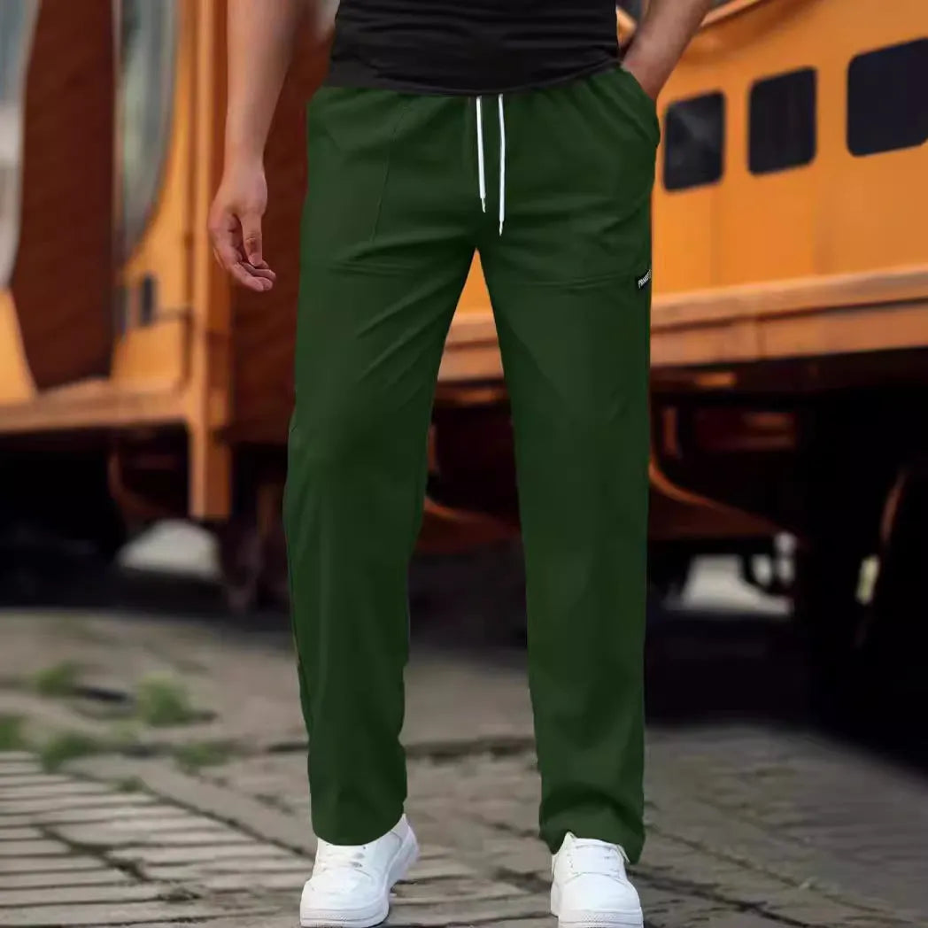 Men's polyester trousers for spring and autumn in light grey colour on a size chart
