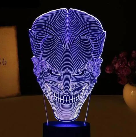 USB-powered 3D acrylic LED lamp showing colourful gradient illumination on a desk.