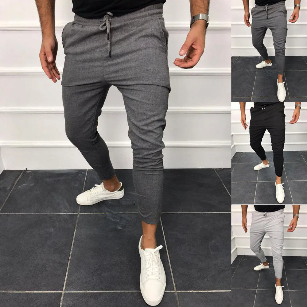 Lace-up casual jogging pants in solid light grey, nine points length, mid-waist, with adjustable front laces