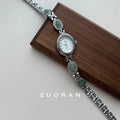 Ladies quartz watch with green jade silver finish and white dial face