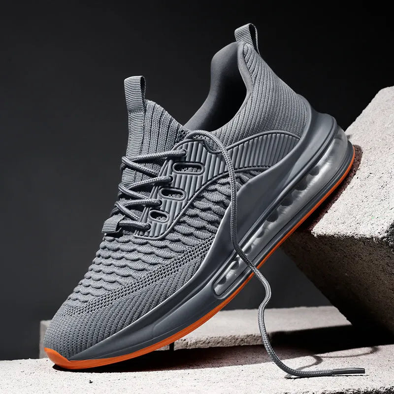 Men's solid colour mesh running sneakers with a round toe and lace-up front on a rubber sole.