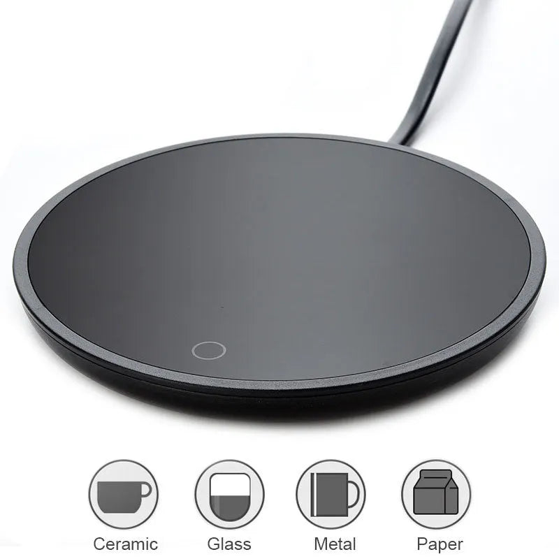 Black dual-temperature coffee mug warmer with low/high switch on a desk.