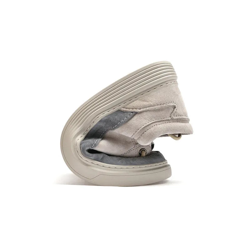 Men's grey low-top casual skate shoes with pigskin upper and rubber sole, shown from the side.