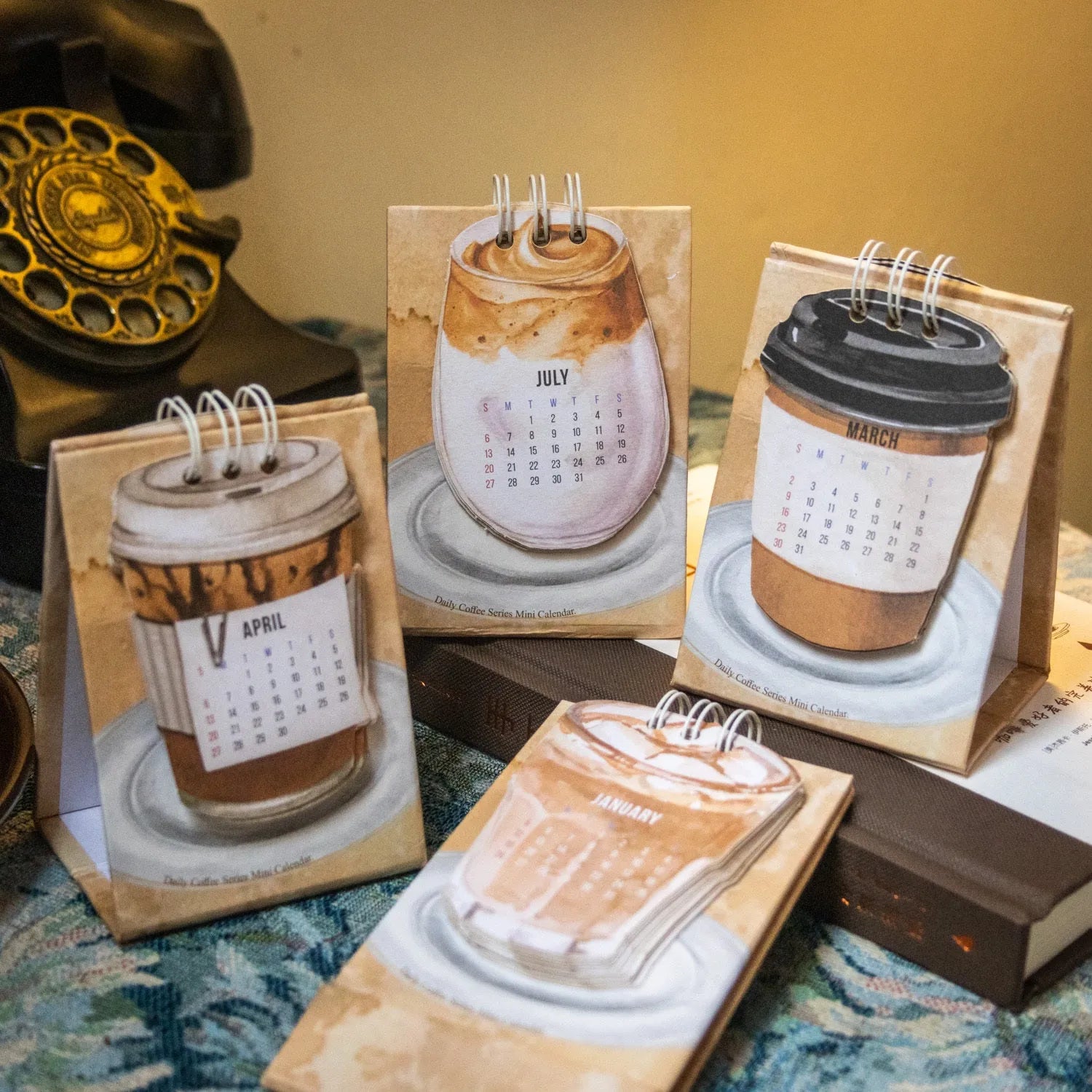 Coffee-themed 2025 mini desk calendar showing four simple modern design options