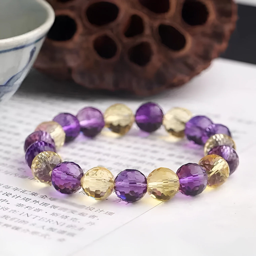 Close-up of a 128-facet cut crystal ametrine bracelet with detailed bead modelling on a wrist.