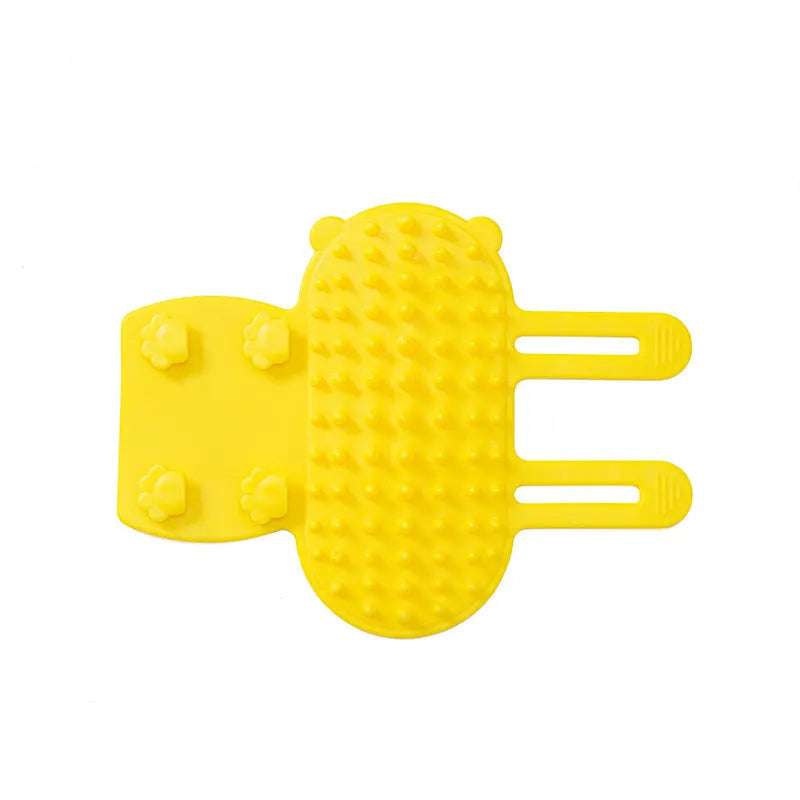 Silicone cat grooming and scratching brush with adjustable strap wrapped around a table leg.