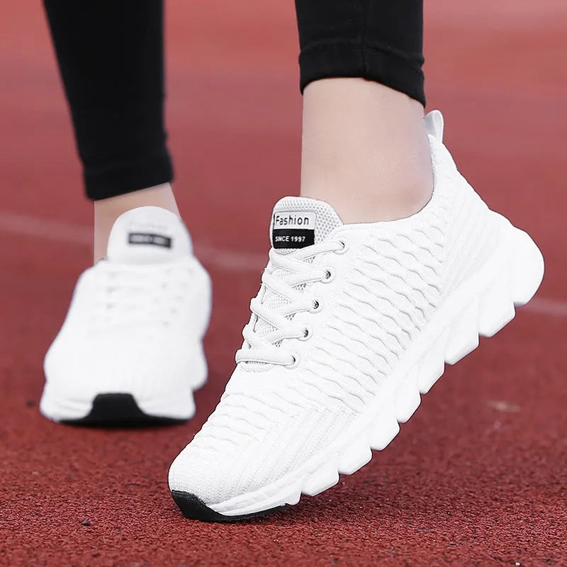 Women's running shoes with fly-weave upper in black, pink and white colour options