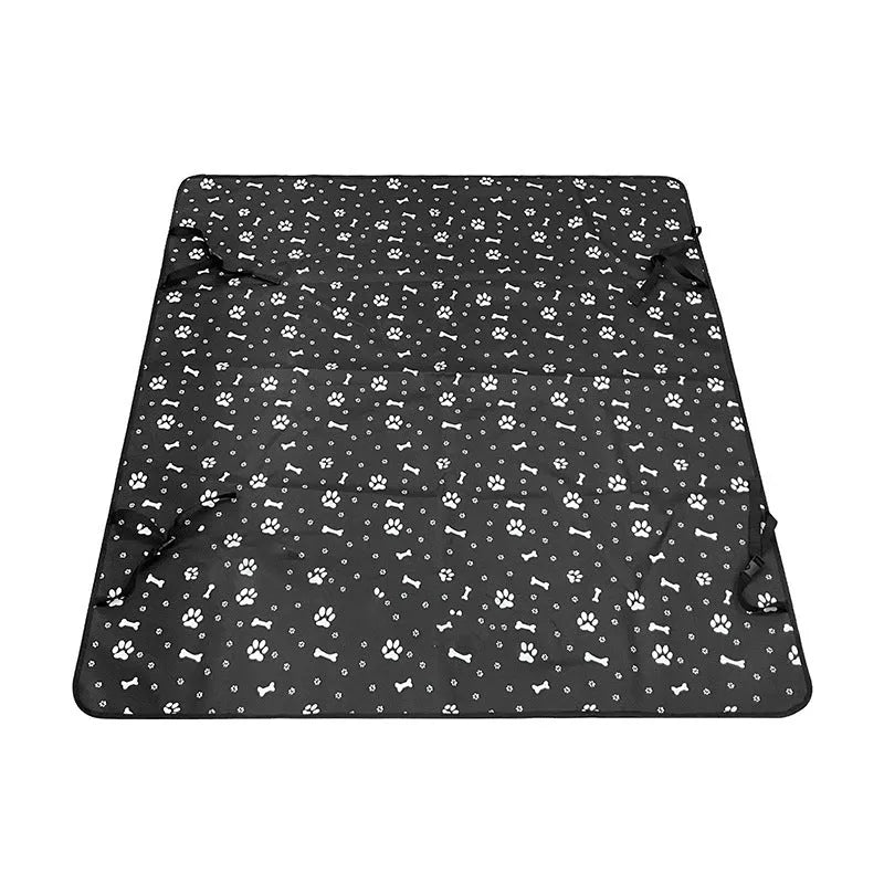 Grey dog bone print water resistant car pet mat measuring 140x110cm on a car rear seat.
