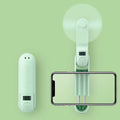 Folding mini personal fan in green colour showing collapsed and open positions with USB charging cable