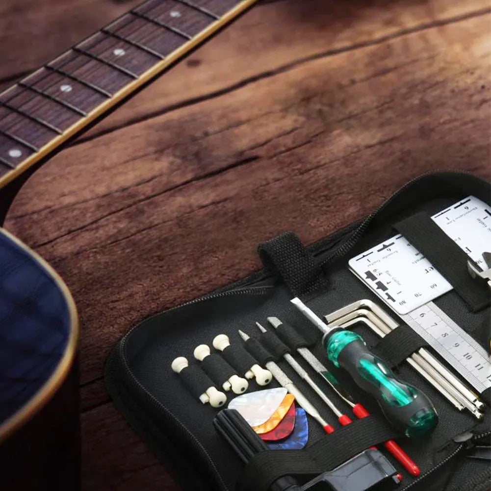 Black plastic and metal guitar repair kit for guitar, bass, mandolin, and banjo.