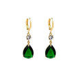 Geometric green teardrop alloy earrings on a plain background