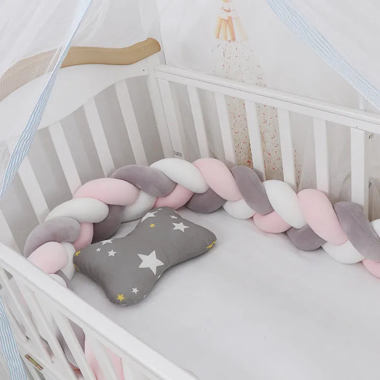 Baby crib bumper braid knot pillow cushion in spandex velvet, shown in a light grey colour