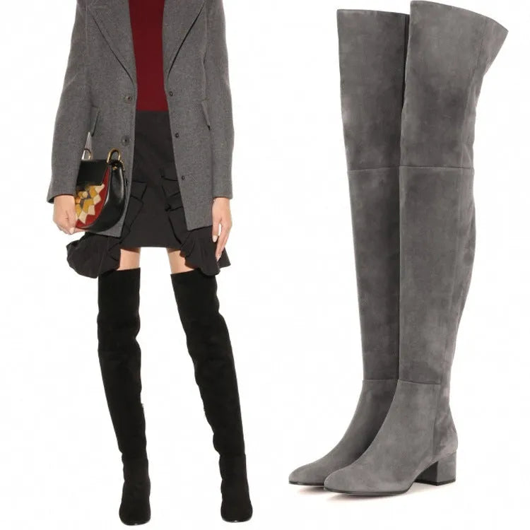 Grey women's flat over the knee suede boots with a pointed toe and low thick heel.