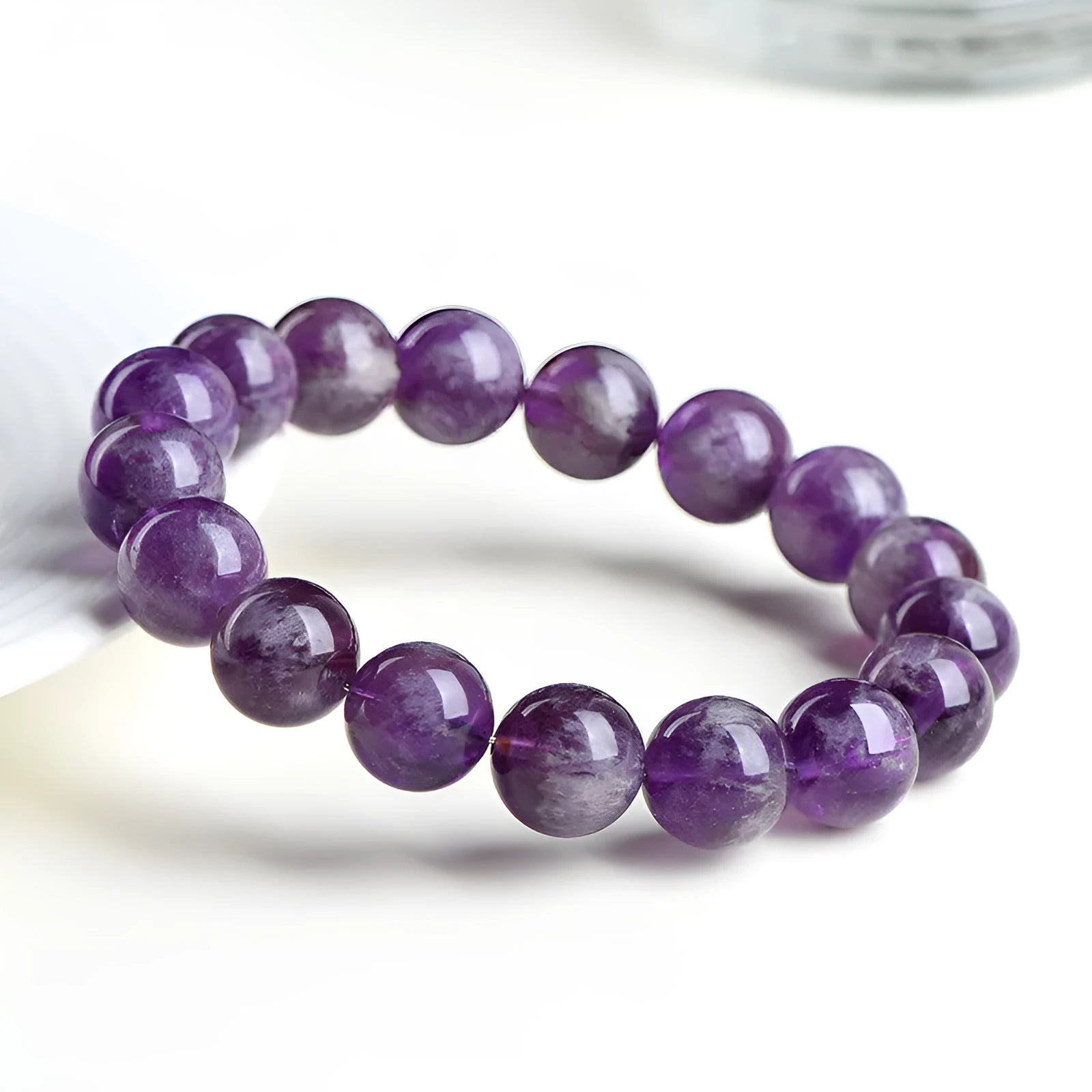 Natural feather amethyst Snow Mountain purple crystal bracelet with geometric beads and Ruyi symbol.