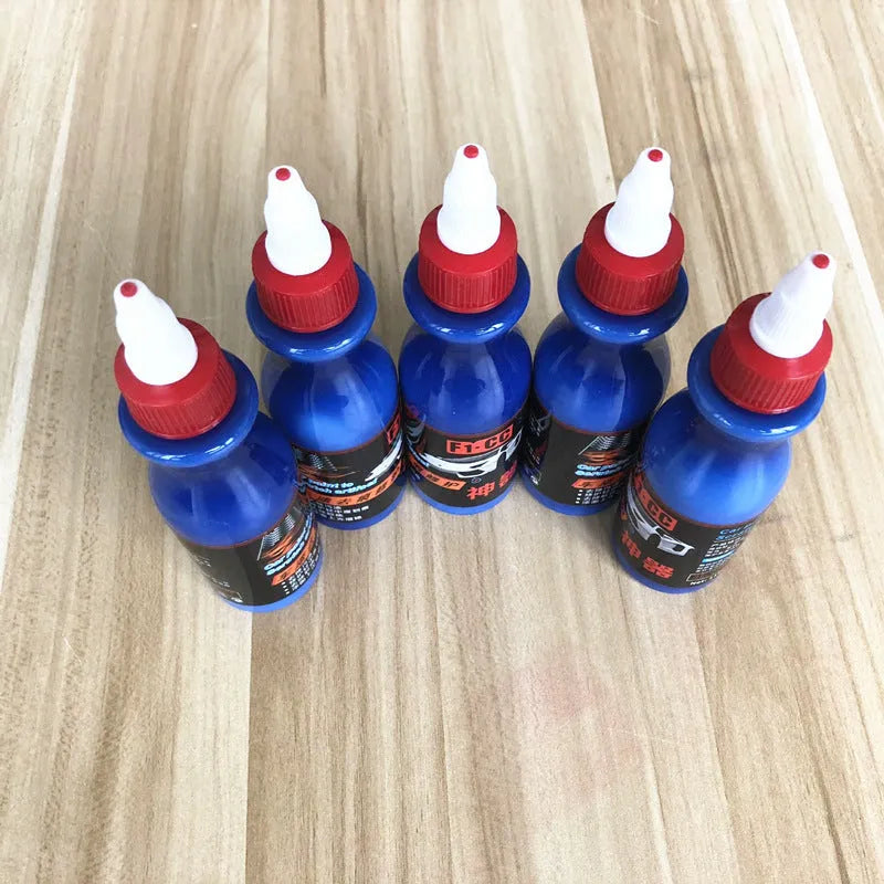 Small blue 10ml automotive scratch repair bottle with integrated applicator brush