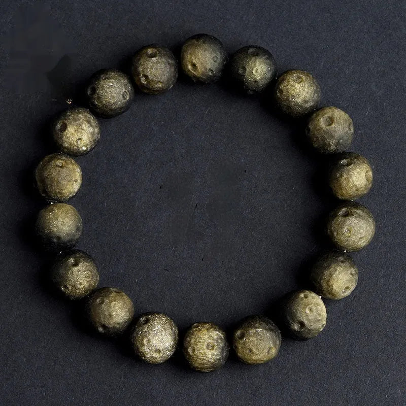 Natural obsidian crater ball bracelet with meteorite texture in silver or gold finish